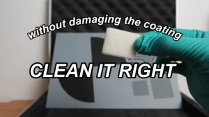 Cleaning a glass calibration target with gloves, an air blower, and a lint-free lens wipe